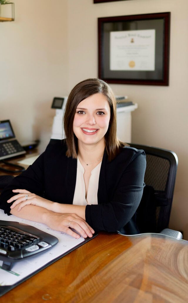 Sydney Kimble at her desk